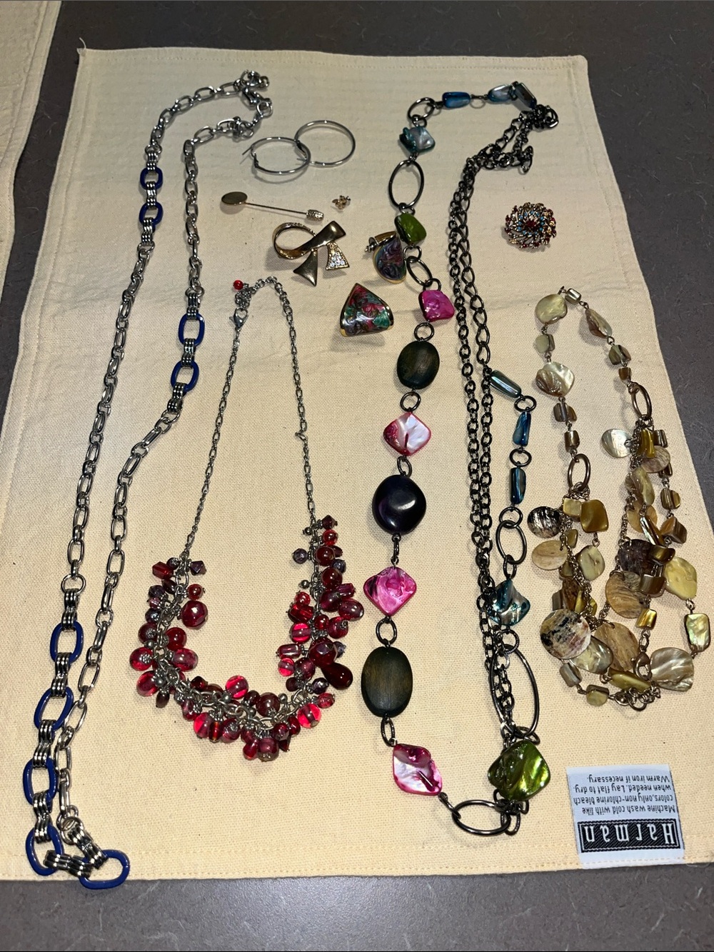 Misc jewelry lot - pins, brooches, necklaces pierced earrings, angel pin